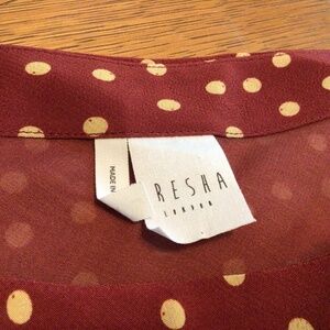 Very trendy one shoulder jumpsuit with one long sleeve. NWOT